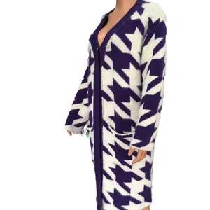 Macro view of purple and white oversized houndstooth pattern on fuzzy knit cardigan