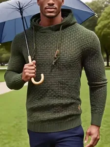 Close-up of olive green men's hooded sweater with textured knit fabric details
