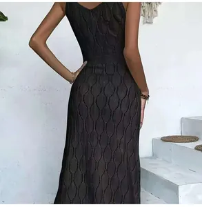 Detailed view of the intricate black crochet knit pattern on a sleeveless beach maxi dress
