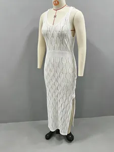 Macro view showing the intricate hollow-out knit texture of this white beach dress