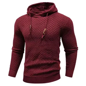 Detail of men's burgundy hooded sweater with textured knit pattern and drawstrings