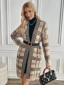 Close-up detail showing the houndstooth knit texture of this elegant long cardigan.