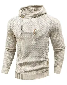 Close-up of a men's cream-colored waffle-knit hooded sweater with drawstring details
