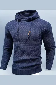 Close-up detail of men's navy blue hooded knit sweater featuring a unique square texture