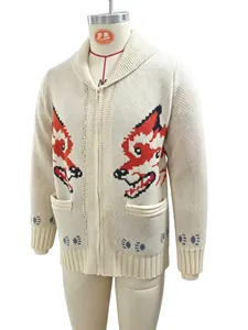 Detailed macro view of cream knit cardigan featuring red wolf jacquard and zipper