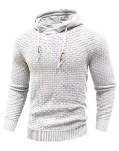 Detailed close-up of a men's white textured knit hoodie featuring a waffle pattern