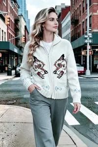 Stylish white vintage wolf jacquard zip-up knit cardigan worn by model on city street