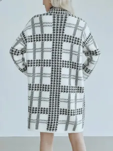 Detailed back view of a long houndstooth knitted cardigan with classic black and white pattern