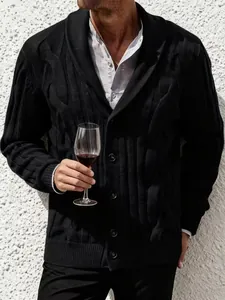 Detail of a men's black cable knit cardigan with an elegant shawl collar and buttons