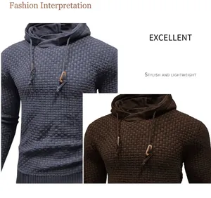 Detail of men's waffle-knit hooded sweater in blue and brown showing texture and drawstrings.