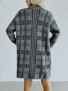 Rear view of a stylish long grey houndstooth pattern knit cardigan coat for women