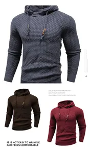 Detailed view of men's hooded knit sweaters in grey, brown and red with textured pattern.