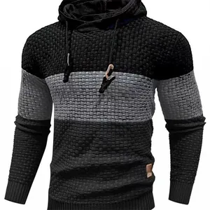 Detail view of textured knit and color-block design on men's hooded casual sweater.