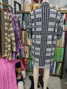 Back view showing the detailed houndstooth pattern of a long knitted cardigan sweater