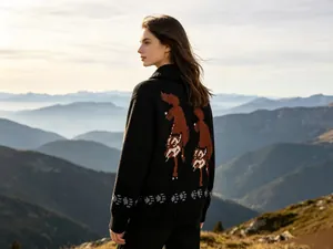 Rear view of vintage black zip-up cardigan featuring double wolf jacquard pattern