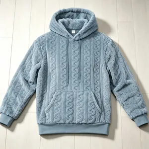Close-up detail of cable knit textured fleece hoodie in soft blue for winter warmth