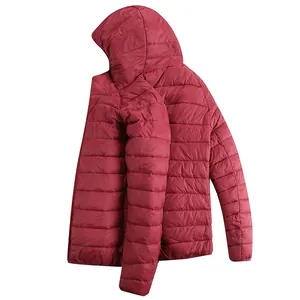 Detailed view of the hooded red quilted heated jacket showing texture and stitching.