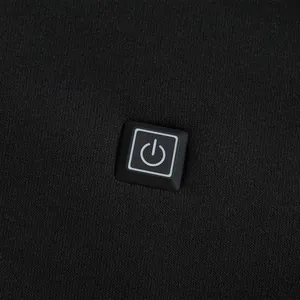 Detailed view of the integrated square power button on a black USB heated hoodie