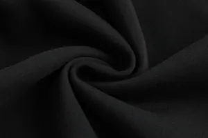 Detailed close-up of premium black fabric texture for heated hoodie showing knit material
