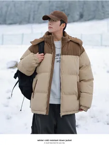 Outdoor shot of a beige and brown corduroy color-block winter down jacket for men.