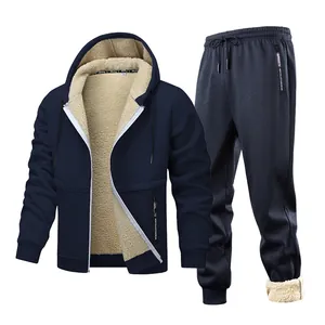 Detailed view of men's navy blue tracksuit featuring thick warm cream fleece lining