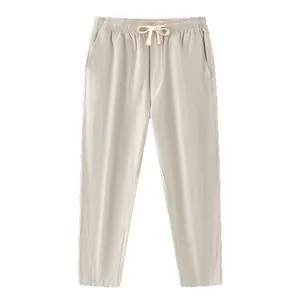 Pantalon décontracté d'été ample en coton et lin pour hommes avec cordon beige.