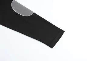 Detail shot of black long sleeve sweatshirt with grey elbow patch and mesh fabric texture