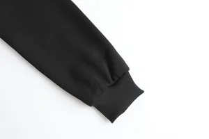 Detailed macro view of black ribbed cuff on electric heated USB hoodie sweatshirt