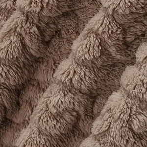 Close-up of brown thick plush fleece fabric for winter men's hooded jacket hoodie.
