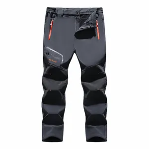Men's outdoor windproof fleece-lined softshell hiking pants with reinforced knees