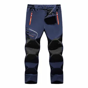 Men's navy blue fleece-lined thermal outdoor hiking pants with windproof softshell