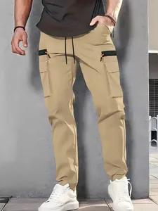 Detail view of khaki multi-pocket cargo pants with zipper accents on a model