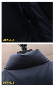 Detailed close-up view of zipper and stand collar on navy blue men's winter padded vest