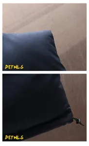 Close-up of navy blue padded vest showing fabric texture and drawstring hem detail