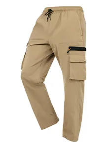 Detailed view of khaki multi-pocket cargo pants with an elastic drawstring waist