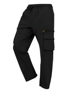 Macro view of black cargo pants featuring multi-pockets and orange zipper accents