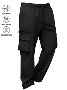 Detail of black waterproof outdoor cargo pants with multi-pocket design and icons