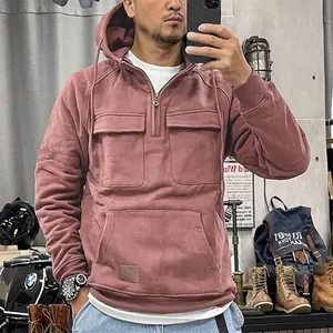 Men's mauve quarter-zip hoodie with multiple cargo pockets and industrial style details