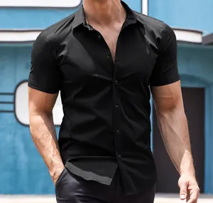 Close-up of a muscular man wearing a slim-fit black short-sleeved casual button-up shirt.