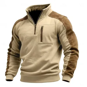 Detailed view of men's quarter-zip sweatshirt with stylish brown suede contrast panels