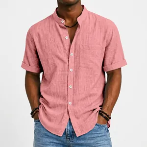 Detailed macro view of a men's salmon pink short sleeve linen shirt with a band collar design