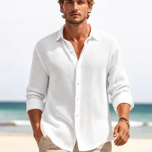 Macro detail of white waffle texture fabric on a men's long sleeve casual shirt at the beach