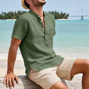 Detail view of green linen men's retro beach shirt with pocket and Henley collar.