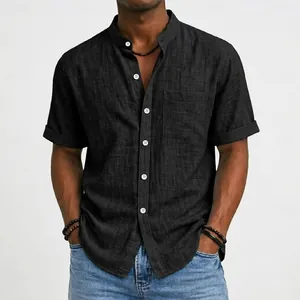 Close-up detail of a men's black short-sleeved linen shirt with a mandarin collar