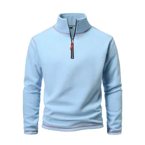 Detailed shot of the quarter-zip and collar on this light blue polar fleece pullover