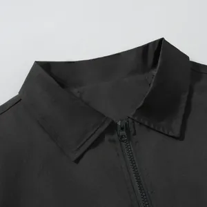 Detail showing the collar and zipper closure of a black men's windproof jacket.
