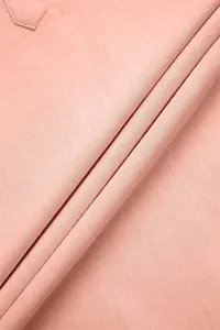 Macro view of breathable pink cotton linen fabric texture for summer men's shirt