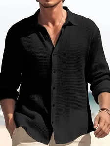 Men's black waffle-textured long-sleeve casual shirt with a classic lapel collar