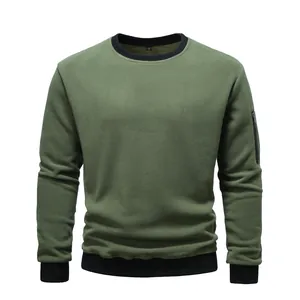 Detailed view of olive green fleece sweatshirt with black ribbed collar and sleeve zipper