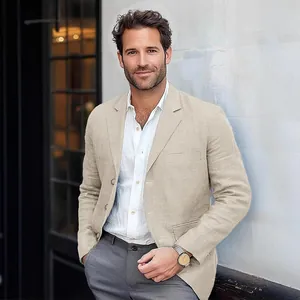 Close-up of men's beige cotton linen blazer with single-breasted lapel for casual style.